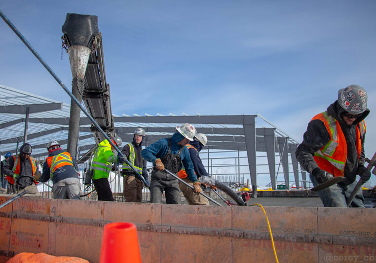 team of construction workers wearing hardhats outdoors